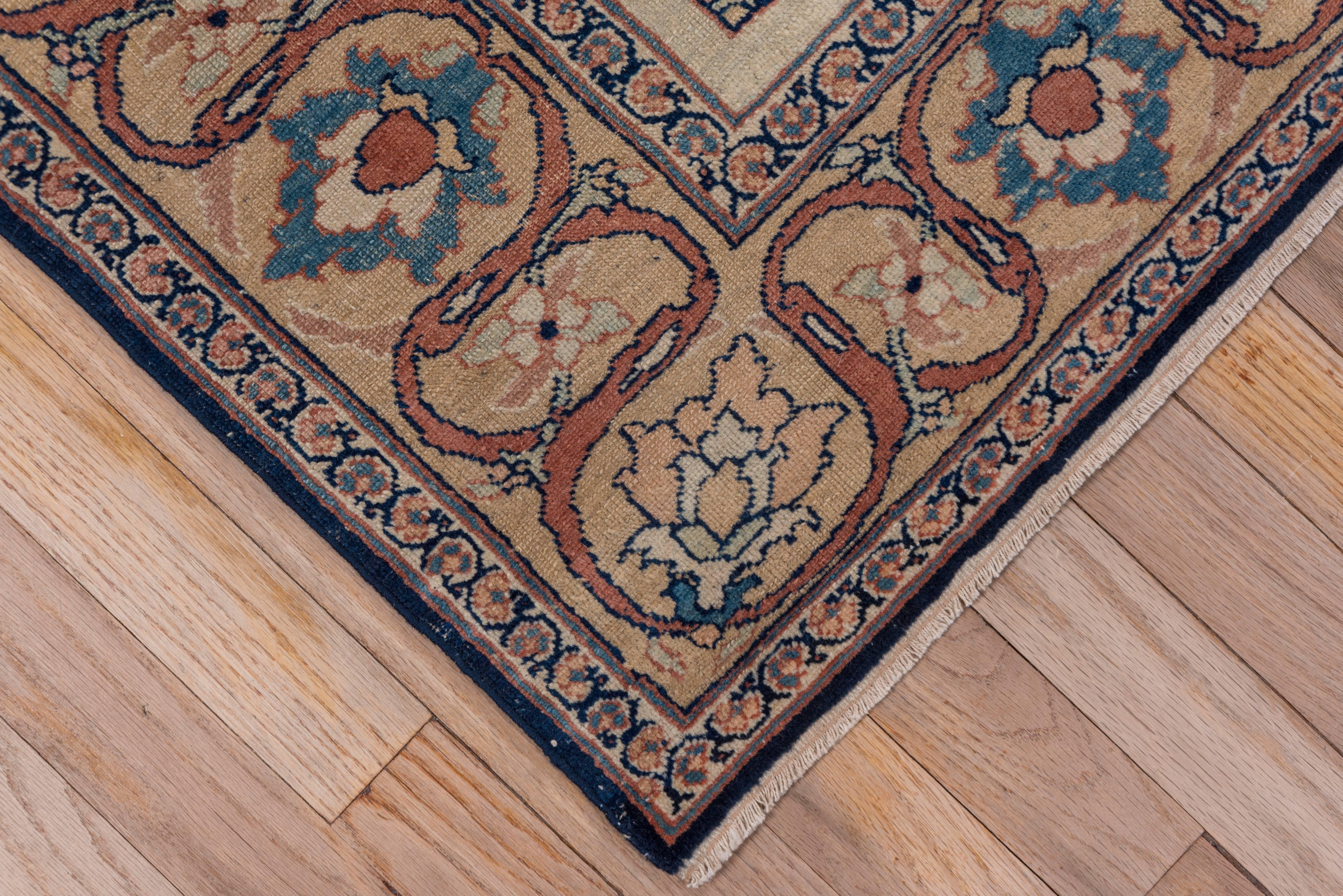 Woven in Northwest Iran, this Tabriz rug is an excellent example of weaving at its best. Centred by a beautifully drawn cusped pendant medallion accentuated by the vinery of the field and completed by a handsome meandering vine and palmette border.