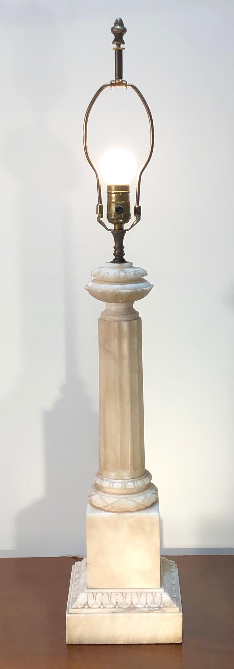 A carved Alabaster table lamp, featuring a classical style column. Completely restored with wiring and a UL listed socket.