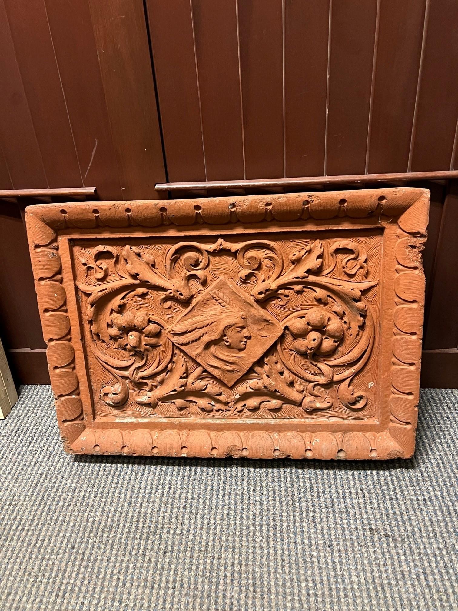 Early 20th century terra-cotta frieze, highly decorative with an Indian Head center and a egg and dart border. Salvaged from the façade of a New York City Building in the late 1970s its in very good condition. This is a great piece that would look