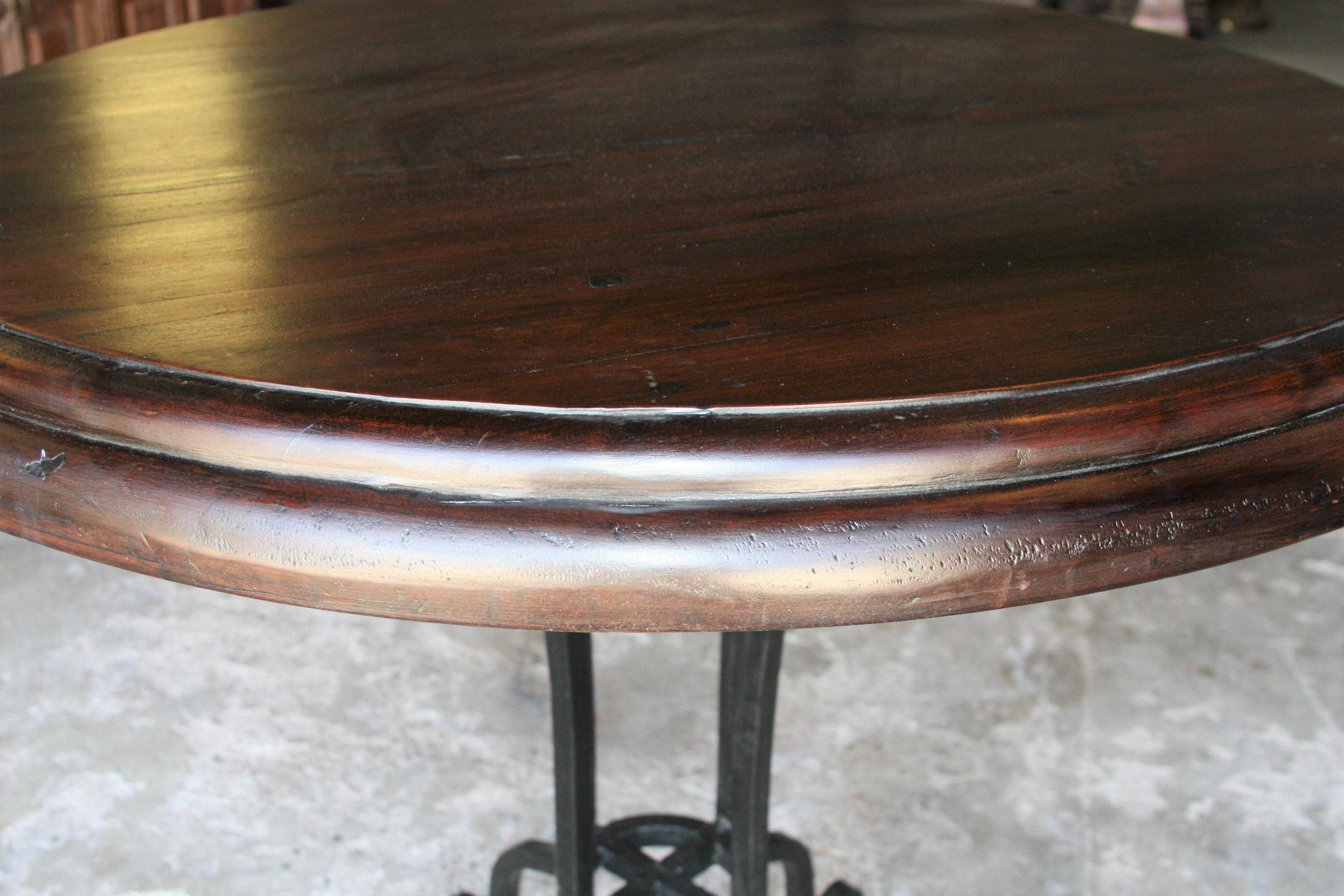 Teak Early 20th Century Thick Top Round Center Table with Hand Forged Iron Support For Sale