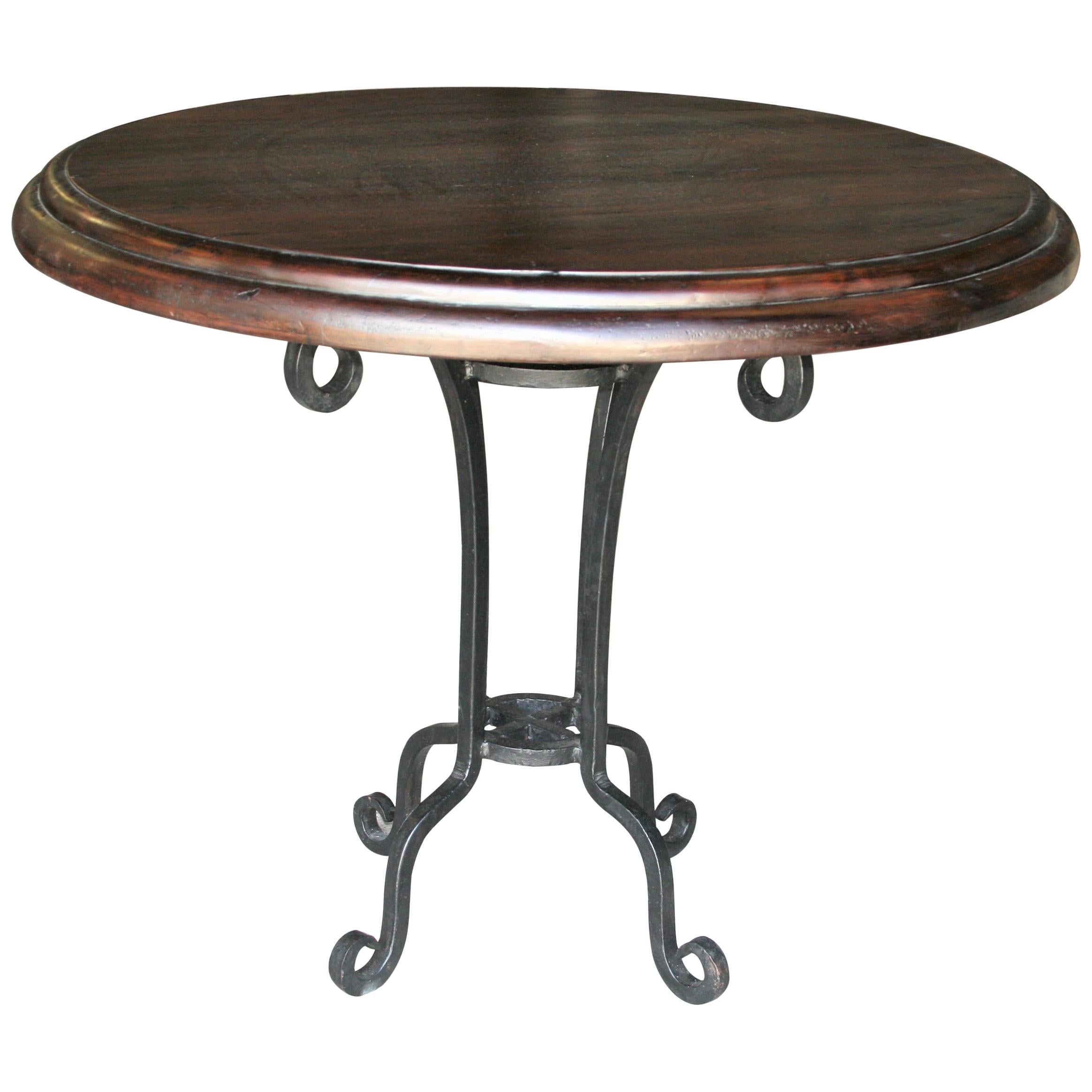 Early 20th Century Thick Top Round Center Table with Hand Forged Iron Support For Sale