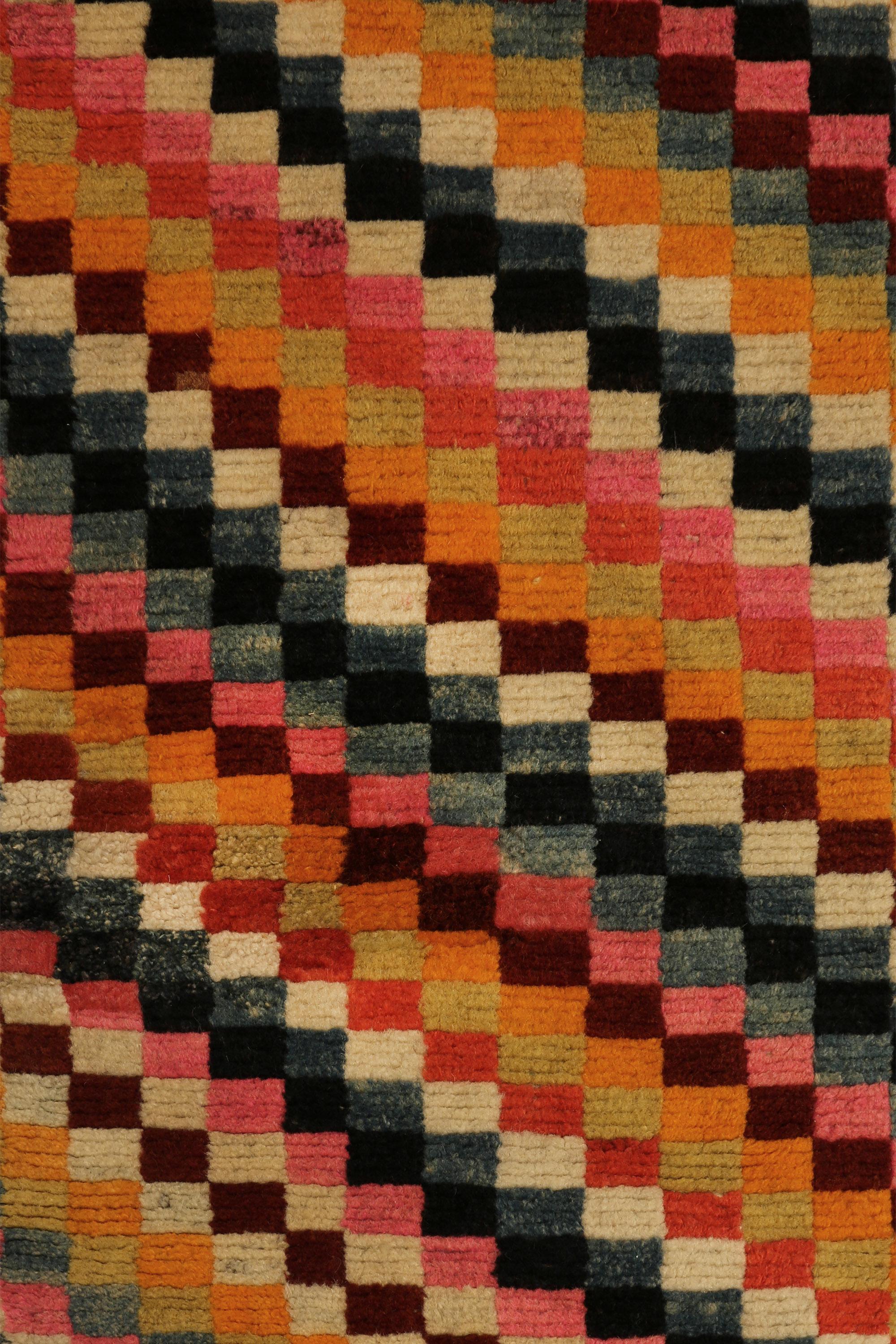 Geometric sleeping carpet, Khaden
This monastic sleeping carpet composed of multicolored checkers evokes joy and serenity. This composition refers to silk patchwork geometric altar cloths that were common in Tibet and used by monks and