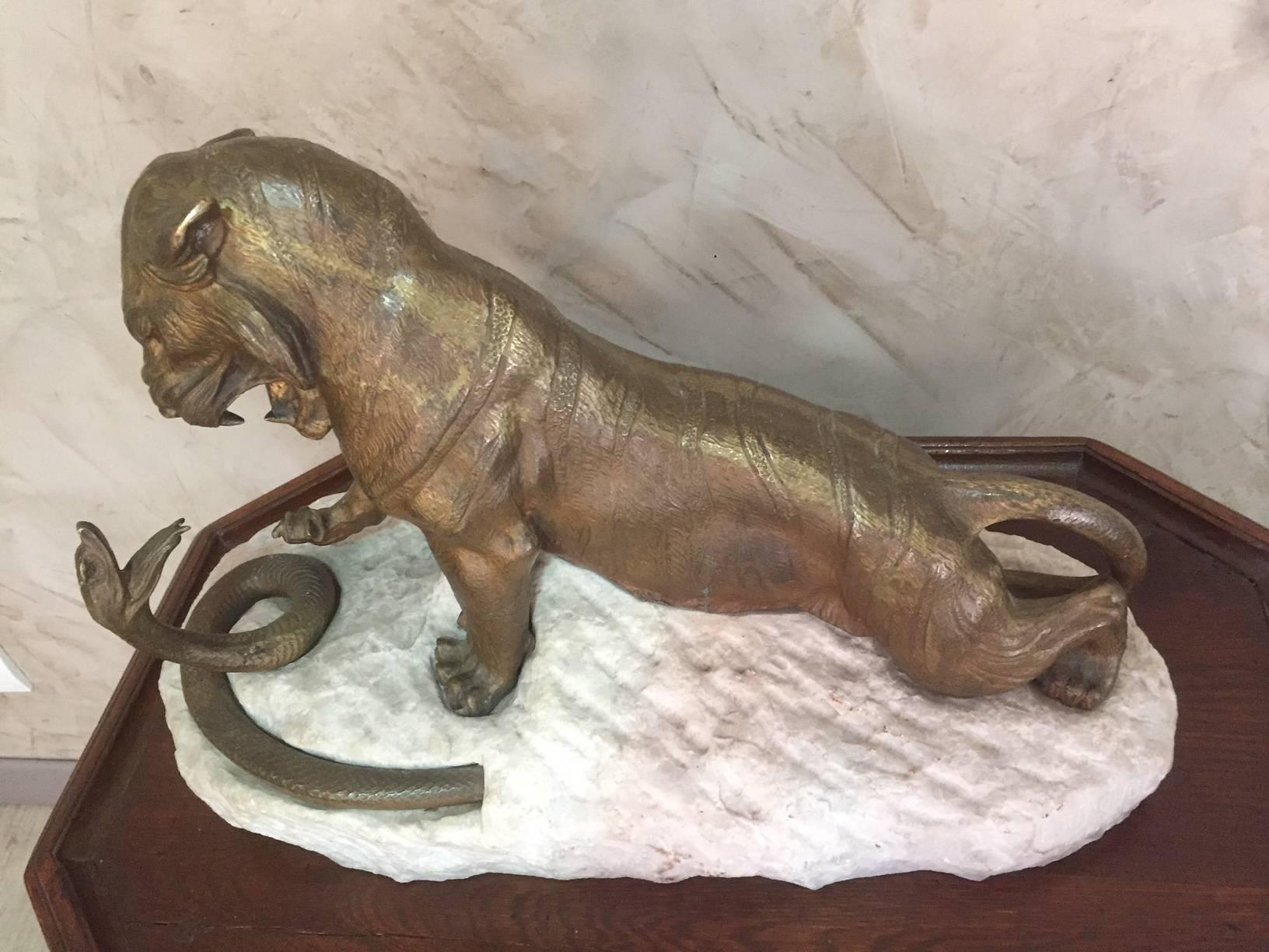 Early 20th century tiger and snake fighting bronze signed by Robert Bousquet (1894-1917) on a stone base.