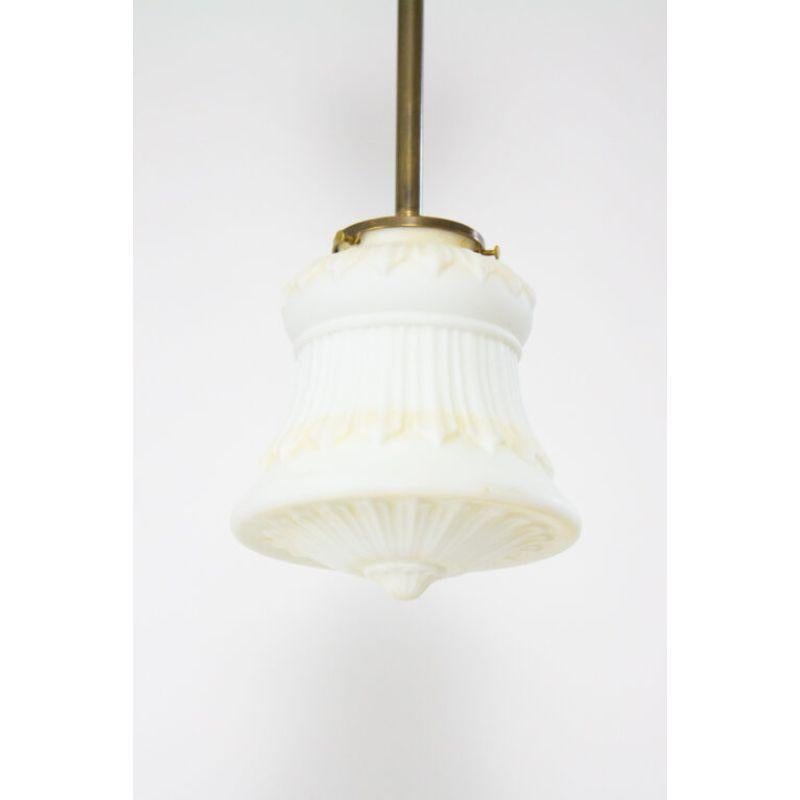 Brass pole fixture with slip canopy and an open fitter. Brass, with an antique patina. Fixture has been completely restored and rewired, complete and ready for installation. Glass is in very good condition for it’s age; Matte white with the original