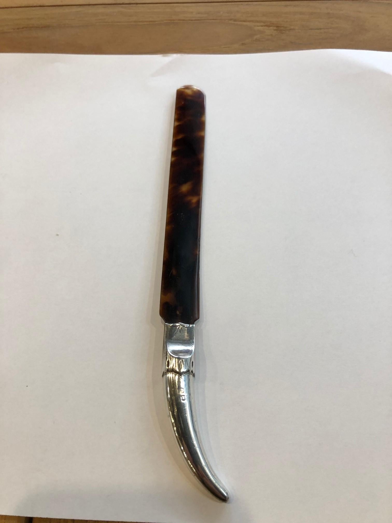 Simply amazing Tortoise Shell letter opener with a sterling silver handle one of the best I have seen. Its a very beautiful looking piece and in one of the photos shows the tortoise shell with light behind it and the colors are amazing. This is from