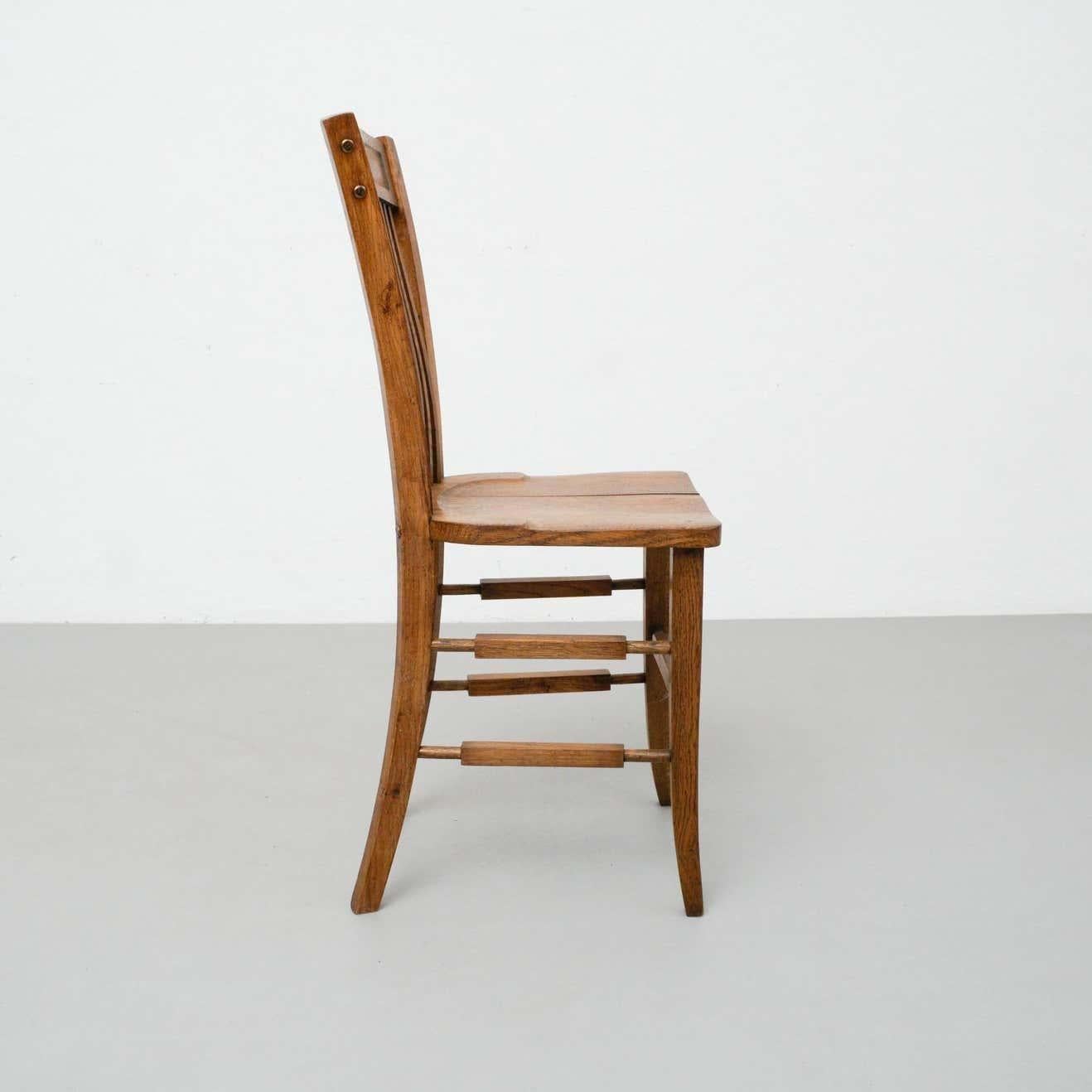 Early 20th century traditional wood chair.
By Unknown Manufacturer. 
France

In original condition with minor wear consistent of age and use, preserving a beautiful patina.
Wood Slats of the seat are a bit separated but doesnt compromises the