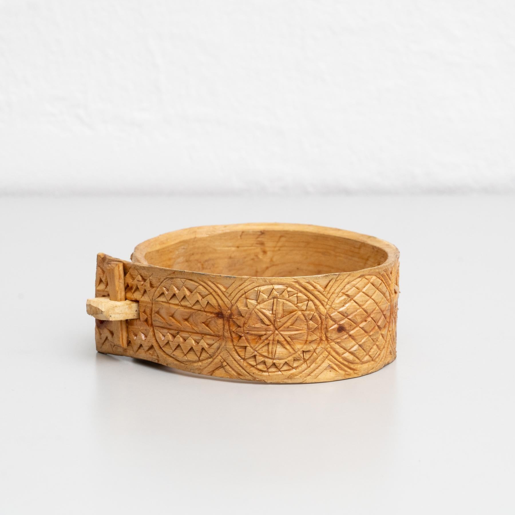 Traditional pastoral primitive carved wood cowbell support.    Handmade in Spain, circa 1900.    In original condition, with minor wear consistent with age and use, preserving a beautiful patina.    Materials:  Wood.