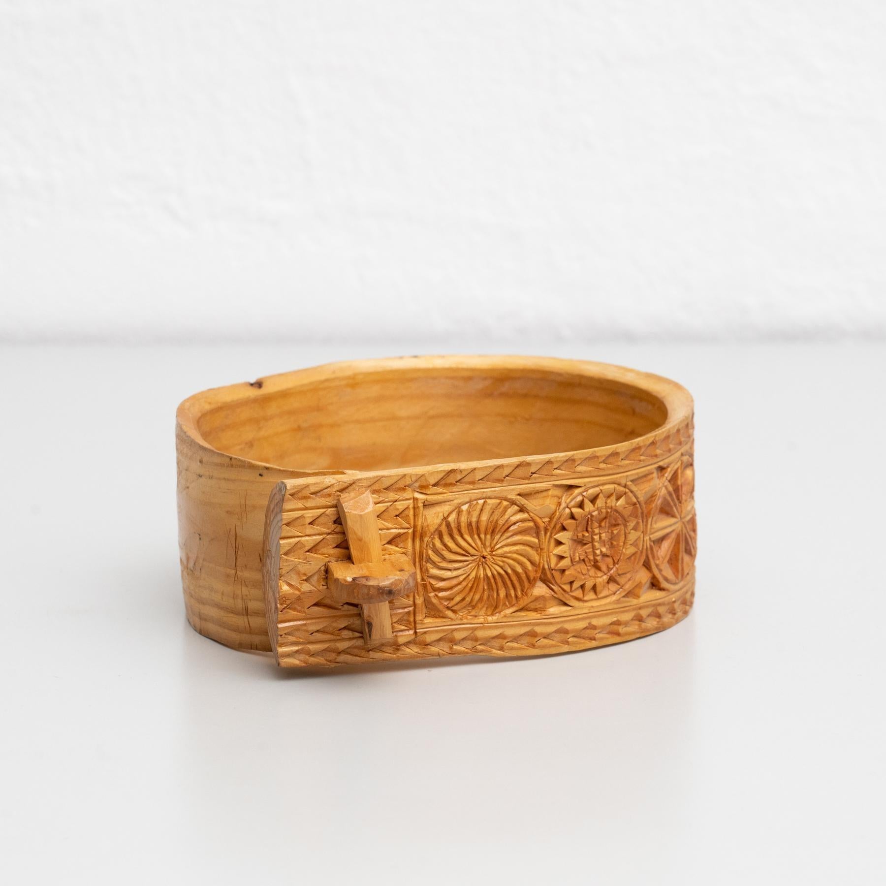 Traditional pastoral primitive carved wood cowbell support.    Handmade in Spain, circa 1900.    In original condition, with minor wear consistent with age and use, preserving a beautiful patina.    Materials:  Wood.   