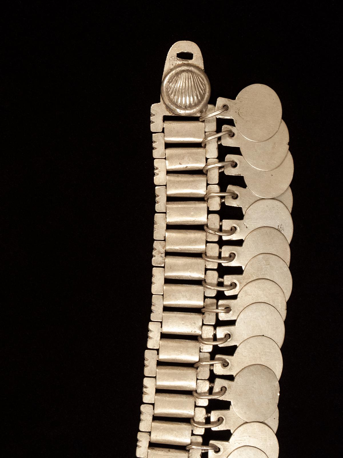 Early to mid-20th century Trarilonco headband, Mapuche people, Chile

Made of high quality nickel silver, this traditional adornment would have been worn as a headband, but it can also be worn as a necklace with a clasp that will be provided on
