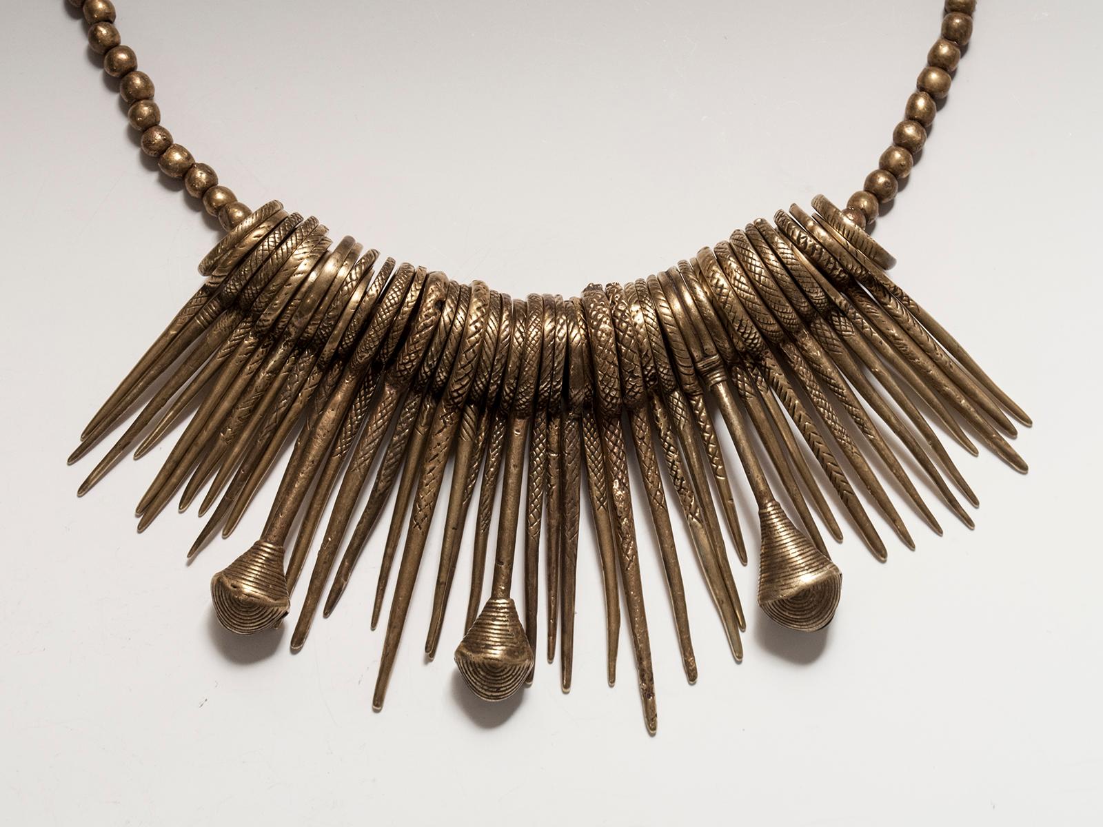 Early 20th century tribal bronzed cache-sexe modesty apron, Vere People, Cameroon

A heavy set of bronze spikes interspersed with three bells forms this cache-sexe from the Vere people of Cameroon/northern Nigeria. It contains similar elements as
