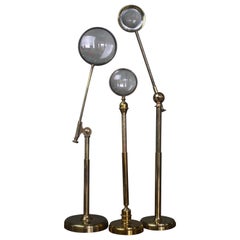 Early 20th Century Trio of Large Brass Adjustable Table Top Condensing Lenses