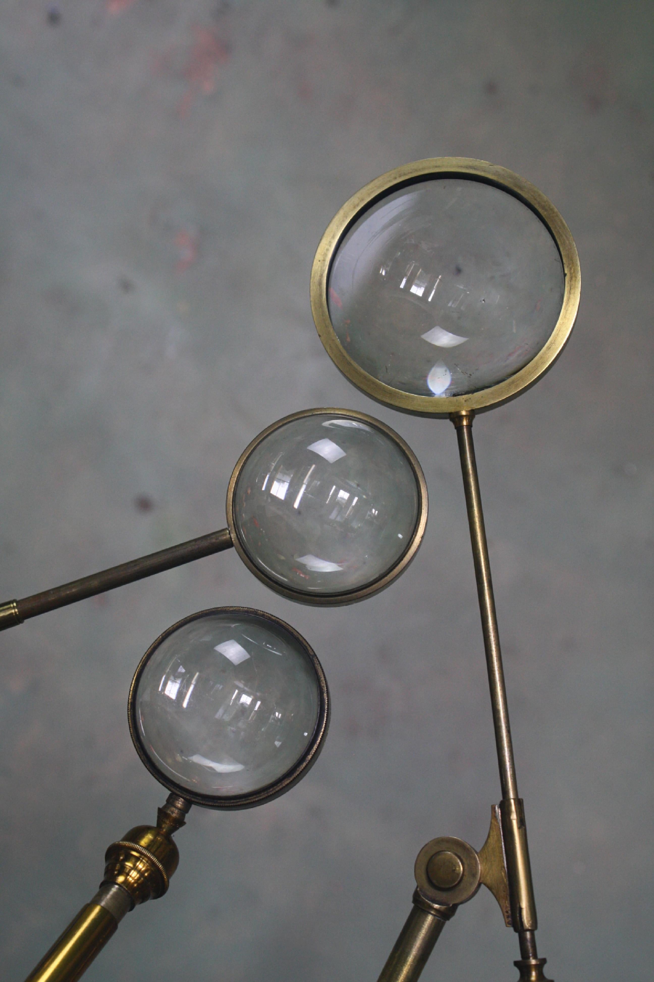 Trio of large fully adjustable telescopic condensing lenses, made from tubular and cast brass. All glass section are in good order some minor surface ware.

Metal work has age related pitting and blemishers, larger than the standard.

One has a