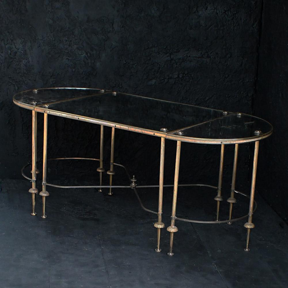 Early 20th Century tripartite (3 part) verre églomisé, Maison Baguès coffee table 
Dimensions in inches: H 17.5” x W 44” x D 20” 
Age: 1930
Origin: France
Condition: Good
Overview
An elegant early 20th Century tripartite (3 part) verre églomisé,