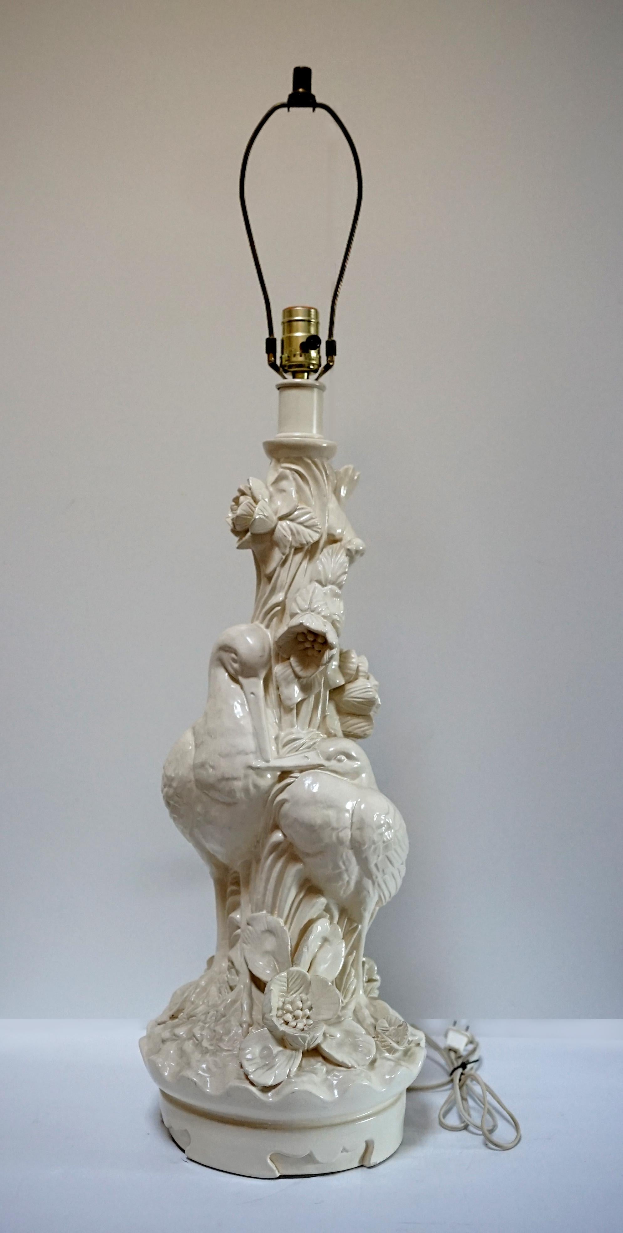 This is a rare piece from the art nouveau period. It is hard to believe your eyes--the sculpted lamp appears to be white porcelain--but look again. It is wood that mimics blanc de chine porcelain. Stunning.
A vintage carved and white painted