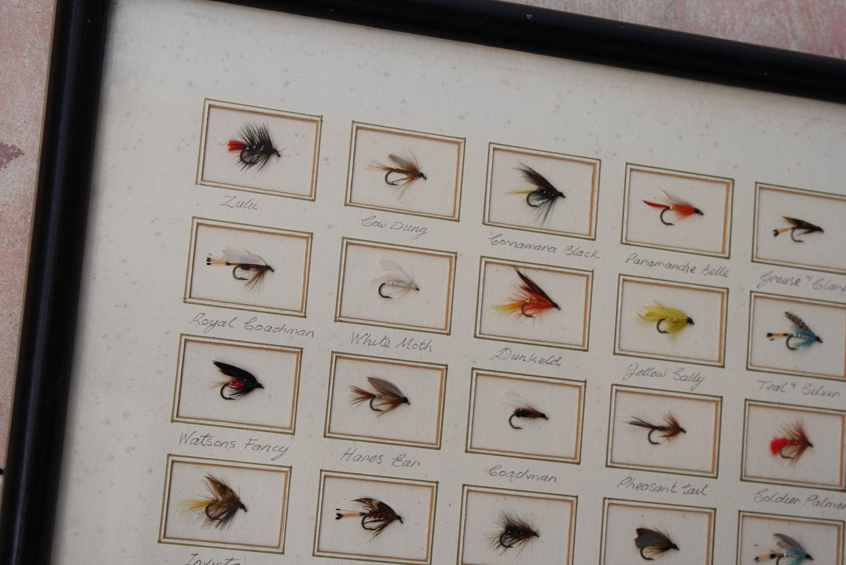 A decorative Edwardian trout fly display, possibly a sale sample for retail. Pleasingly mounted with pencilled names in a later ebonised bullnose frame.

Areas of pitting, and discolouration to the mount boards, the flies are still vibrant in