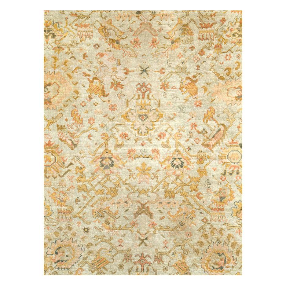 An antique Turkish Oushak large room size carpet in square format handmade during the turn of the 20th century in shades of ivory, rust orange, and gold.

Measures: 11' 10