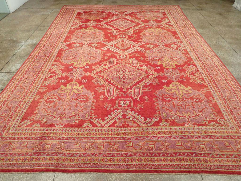 An antique Turkish Oushak large carpet handmade during the Early 20th century.

Measures: 11' 11