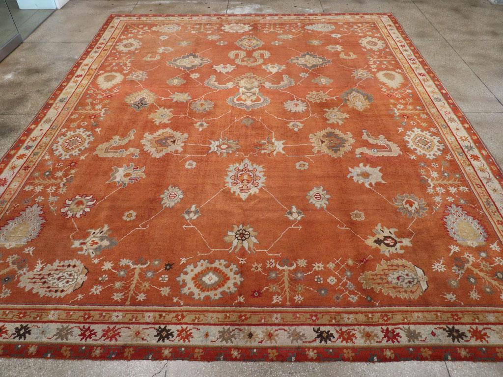 A wool pile of symmetric knot on a wool foundation. This is a spacious rendition of the Indian Agra “in-and-out” design of cloud bands, palmettes, sickle leaves and thin vinery. Inner red main “Implicit” border of blossoming flowers and oval