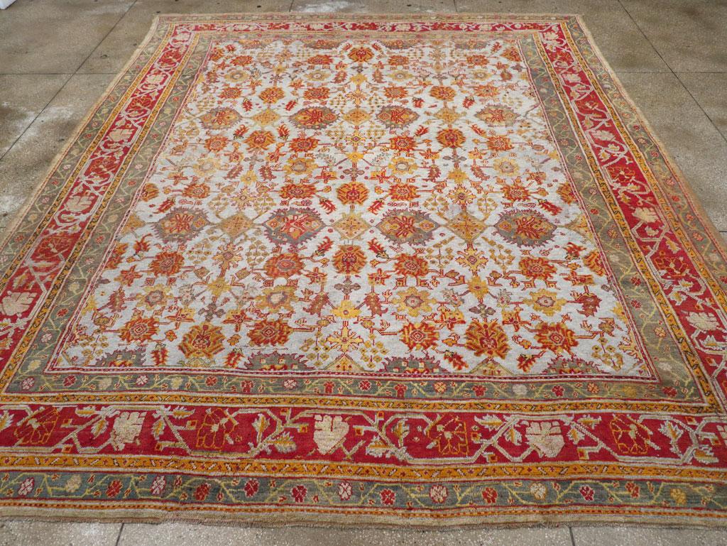 An antique Turkish Oushak large room size carpet handmade during the Early 20th century.

Measures: 12' 0