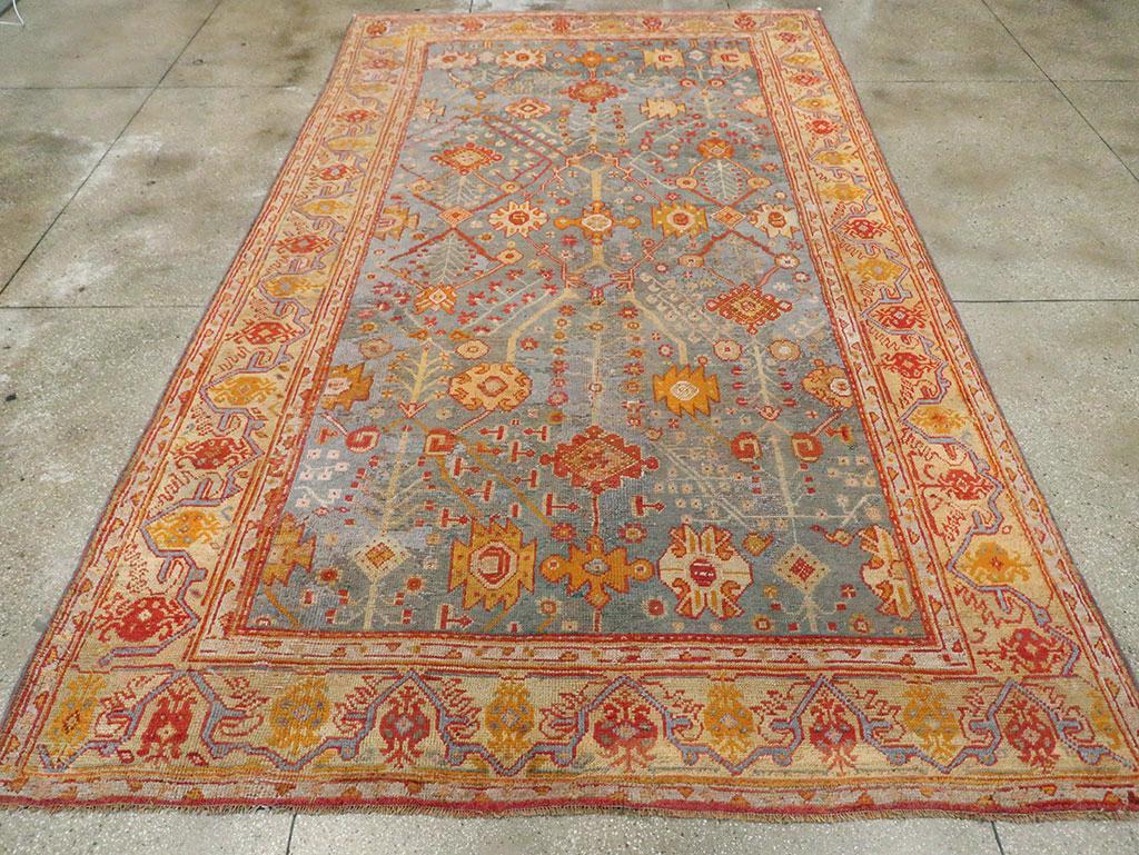 An antique Turkish Oushak room size carpet handmade during the Early 20th century.

Measures: 8' 6