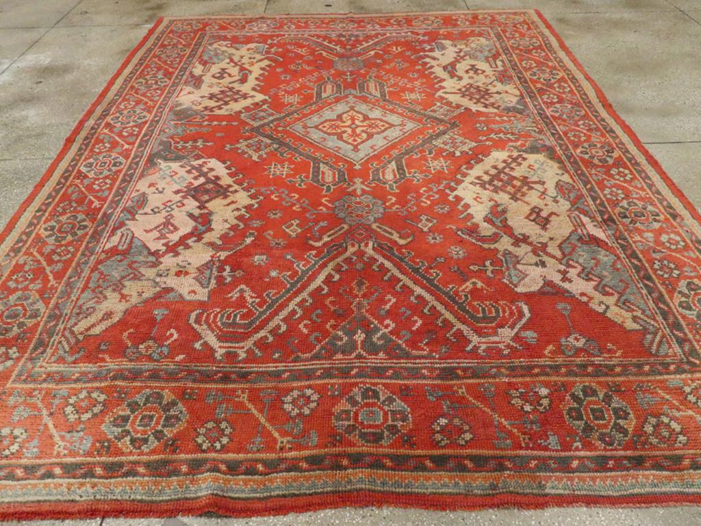 An antique Turkish Oushak room size carpet handmade during the Early 20th century.

Measures: 8' 11