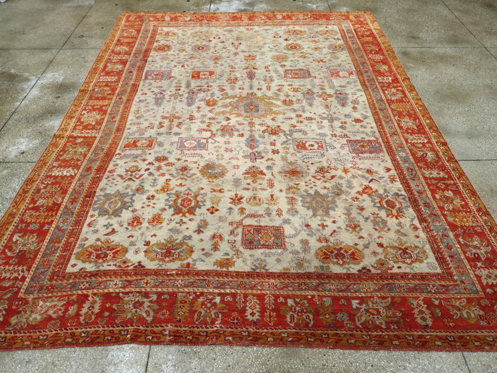 An antique Turkish Oushak room size carpet handmade during the Early 20th century.

Measures: 9' 10