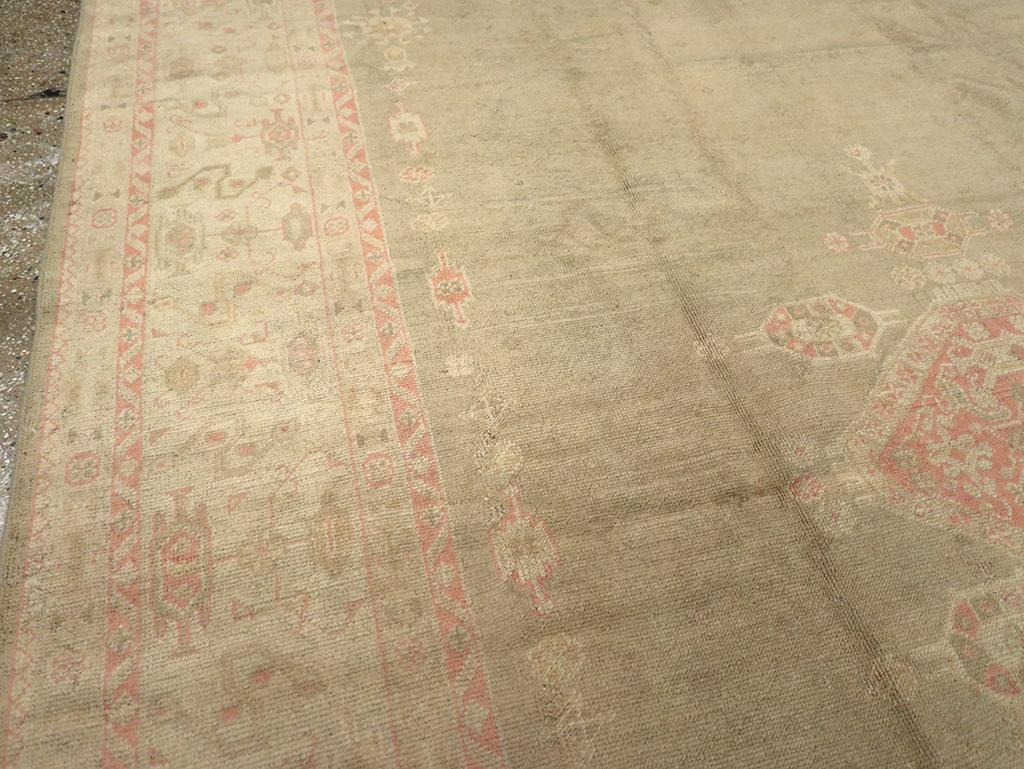 Hand-Knotted Early 20th Century Turkish Oushak Room Size Carpet For Sale