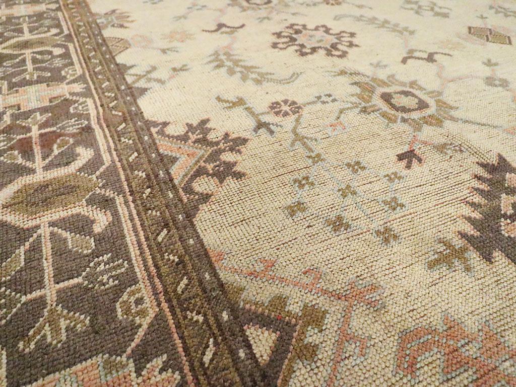Hand-Knotted Early 20th Century Turkish Oushak Room Size Carpet For Sale