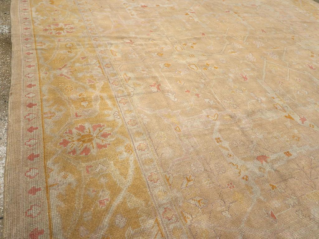 Hand-Knotted Early 20th Century Turkish Oushak Room Size Carpet For Sale