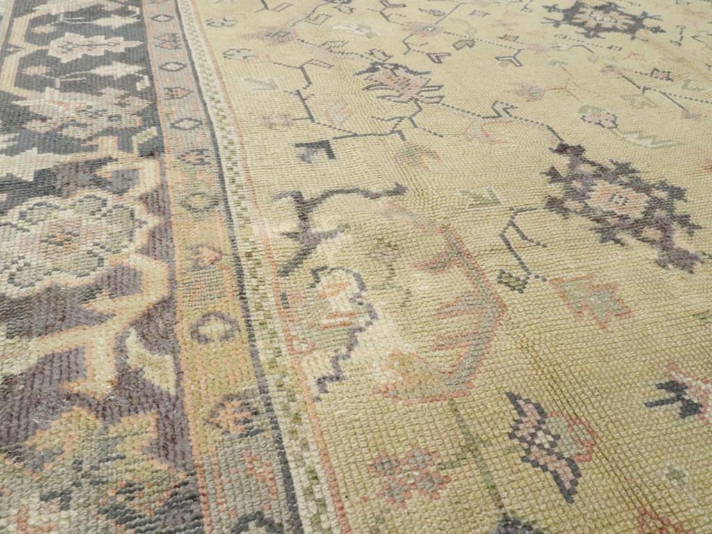 Hand-Knotted Early 20th Century Turkish Oushak Room Size Carpet For Sale