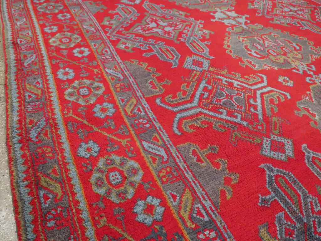 Hand-Knotted Early 20th Century Turkish Oushak Room Size Carpet For Sale
