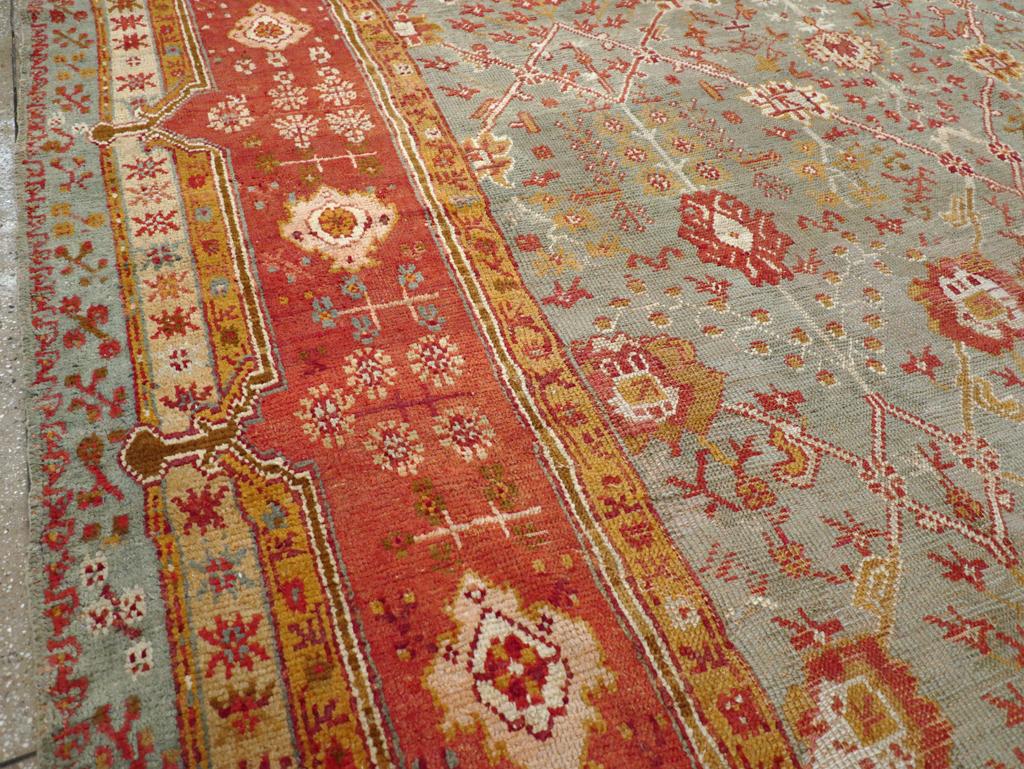 Hand-Knotted Early 20th Century Turkish Oushak Room Size Carpet For Sale