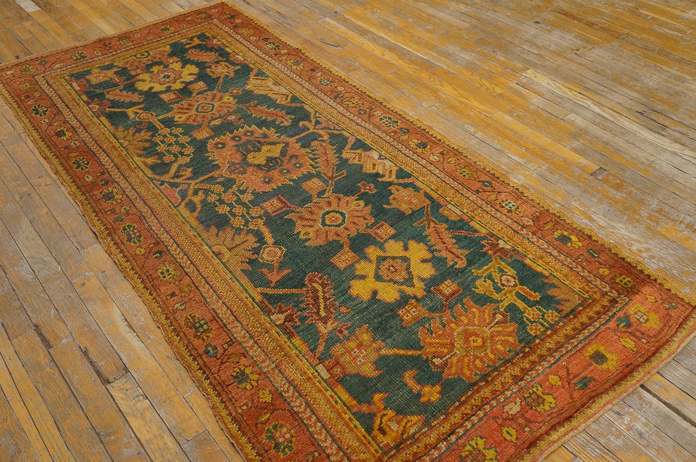 Not every Oushak is room sized. This snappy little rug with an imaginative segment of the harshang pattern on an attractively variegated sapphire blue ground is uncommon among these west Turkish weavings. The red main border has Persian roots in