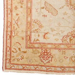 Early 20th Century Vintage Biege Stylized Floral Turkish Oushak Rug