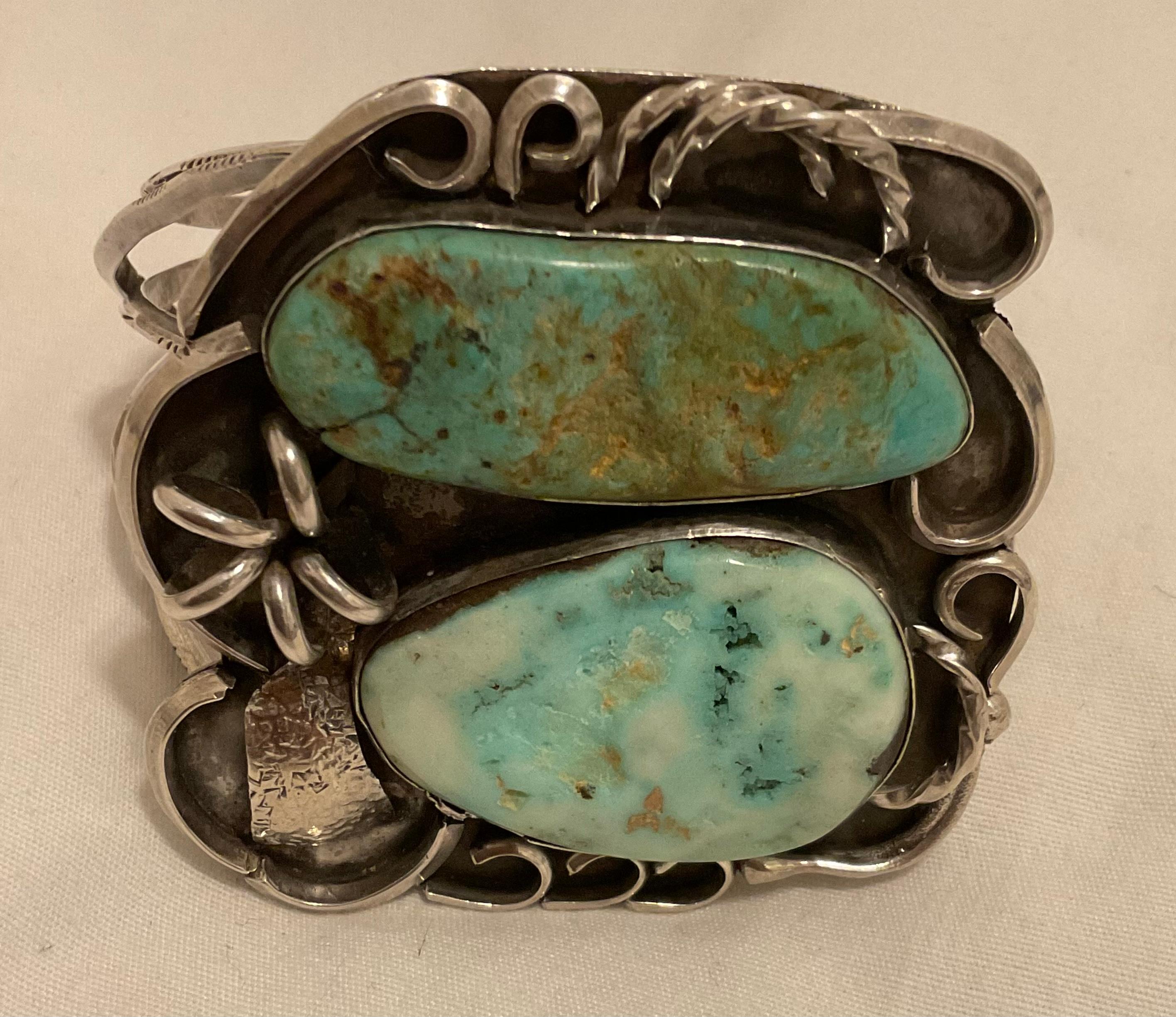 This extremely rare cuff is one of the oldest I've offered. It dates to the 1920s, as per the previous owner, and is hand stamped J.W. It is sure to please any Native American jewelry aficionado. The Bird's Eye Turquoise is white in spots and the