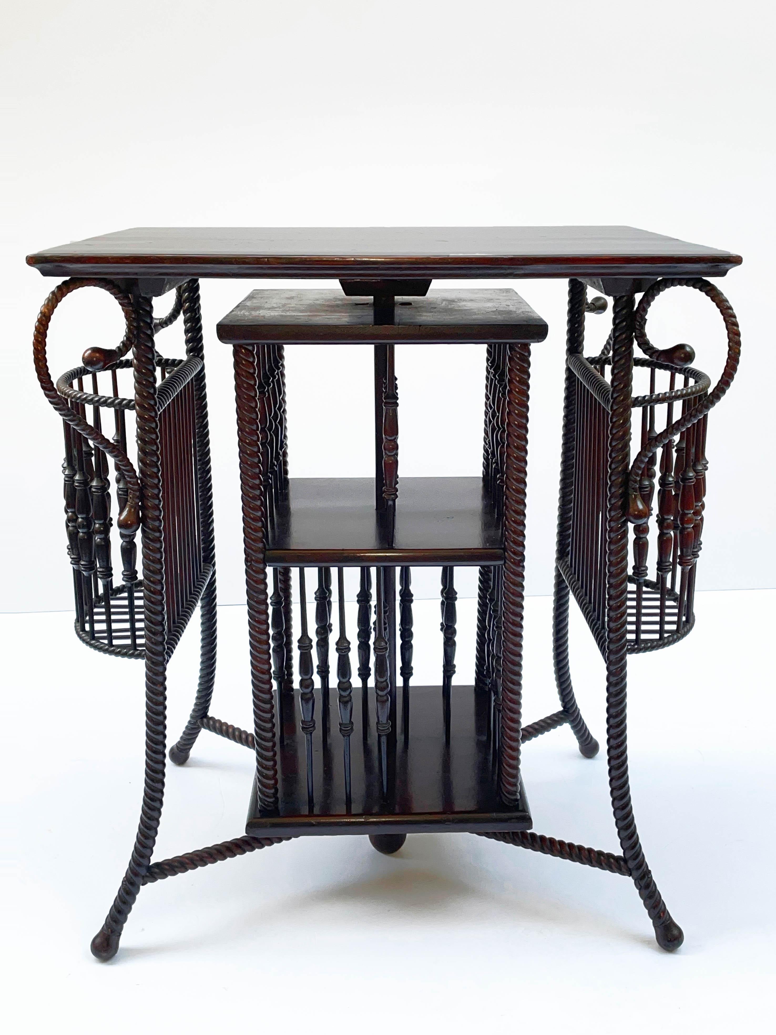 Rare and solid ancient revolving bookcase with precious twisted wood artisanal production. This amazing and unique piece was designed in Austria at the beginning of the 20th century.

This extraordinary piece is fantastic because of the artisanal
