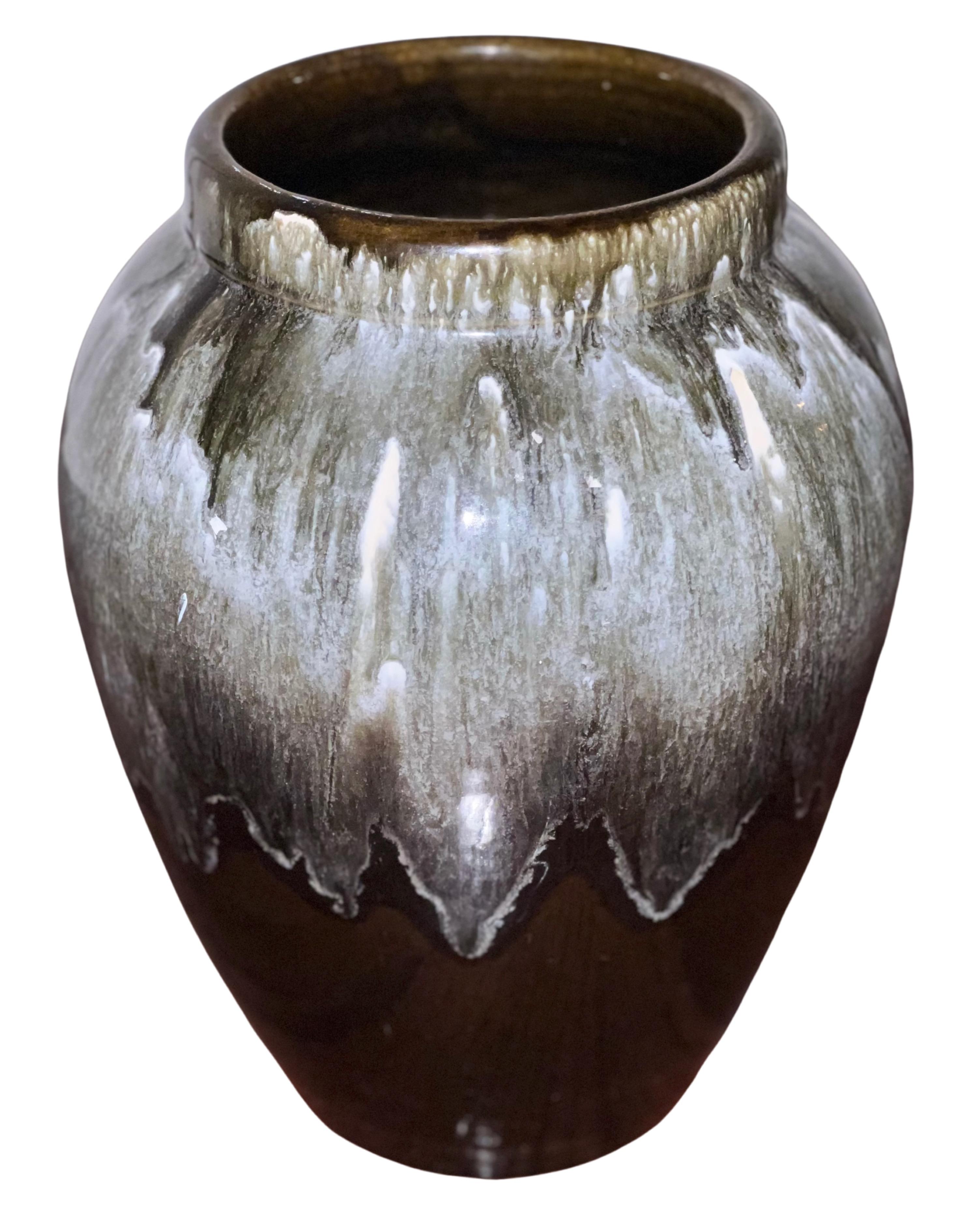 Beautiful early 20th century drip glaze planter. Handcrafted during WWI, the planter is marked U.S.A. on the bottom to denote country of origin as some studios chose to express their patriotism. 

The planter features a drip glaze in muted tones