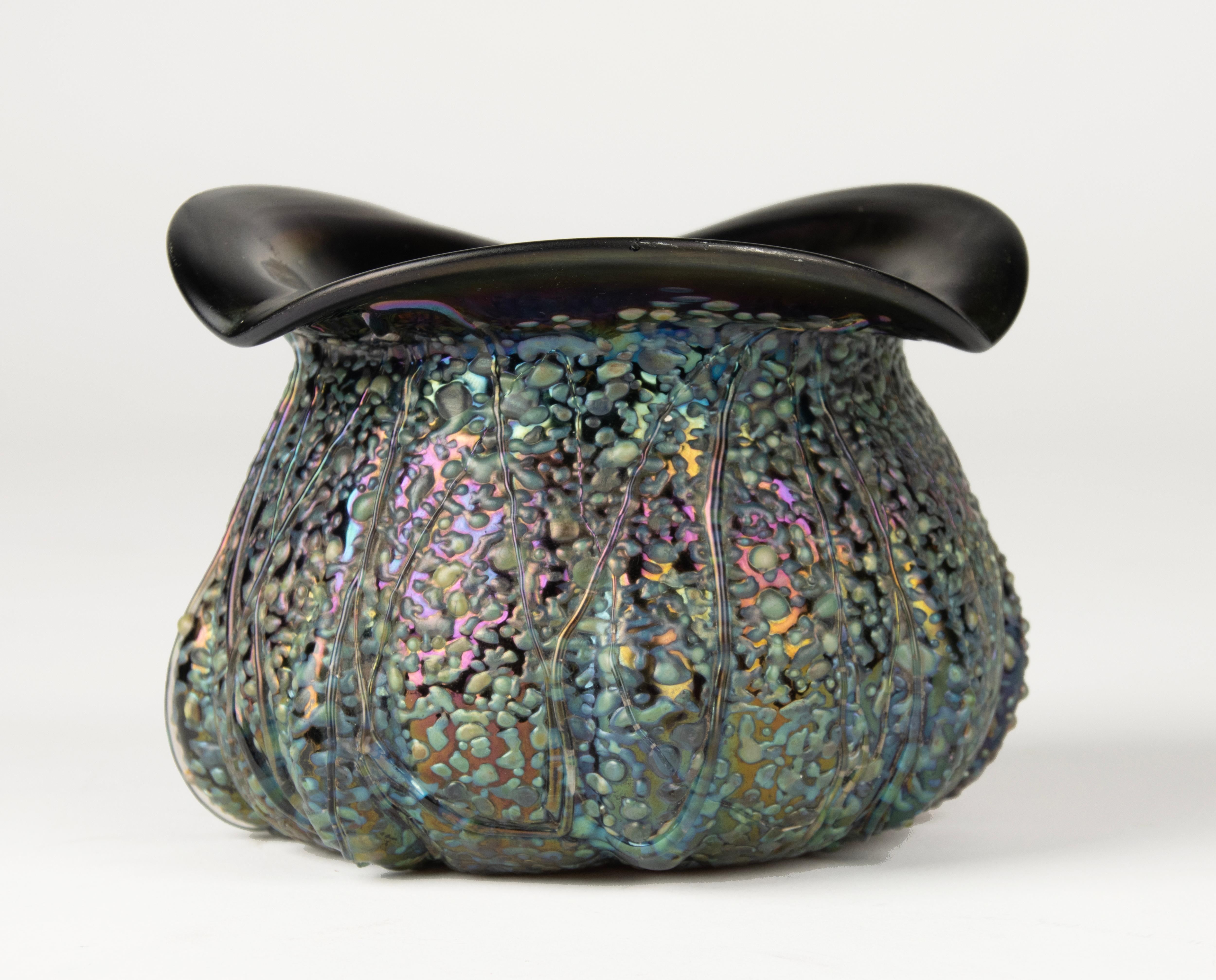 A beautiful early 20th-century art glass vase attributed to Loetz, the renowned Bohemian glass manufacturer celebrated for its innovative iridescent finishes and sophisticated Art Nouveau designs.

This piece displays several distinctive hallmarks