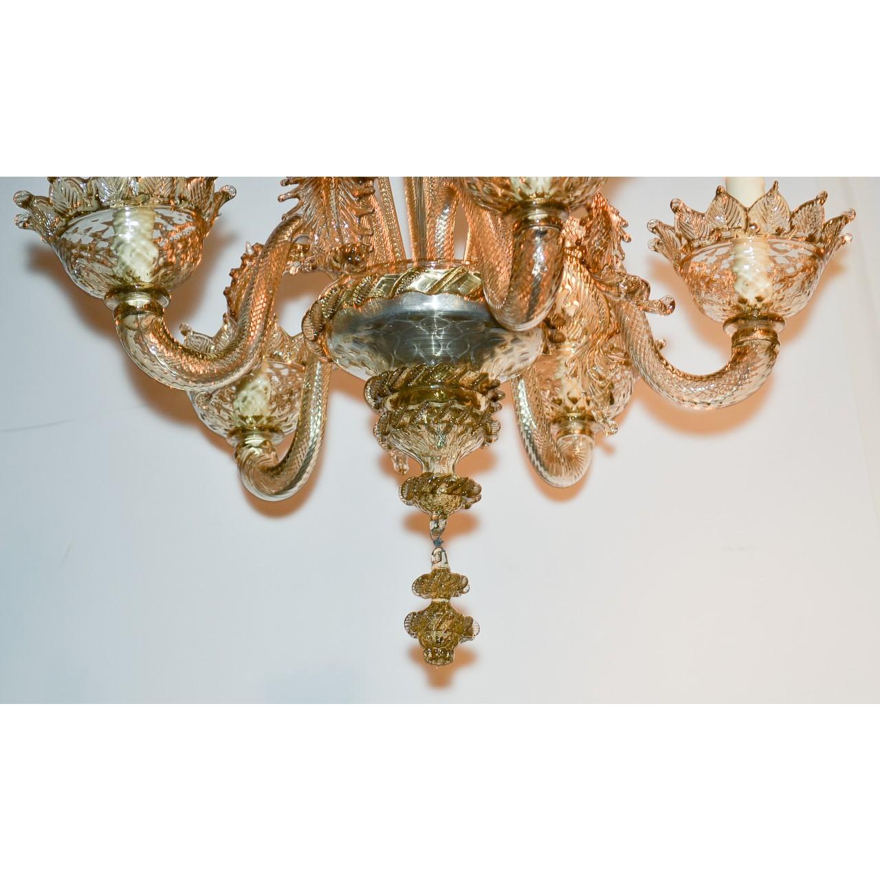 Superior Venetian chandelier in hues of rich amber to clear glass. The bowl-shaped canopy with a flower petal border atop long shaped and ruffled leaf sprays accented with large shooting stems and flower heads. Mounted with gracefully contoured arms