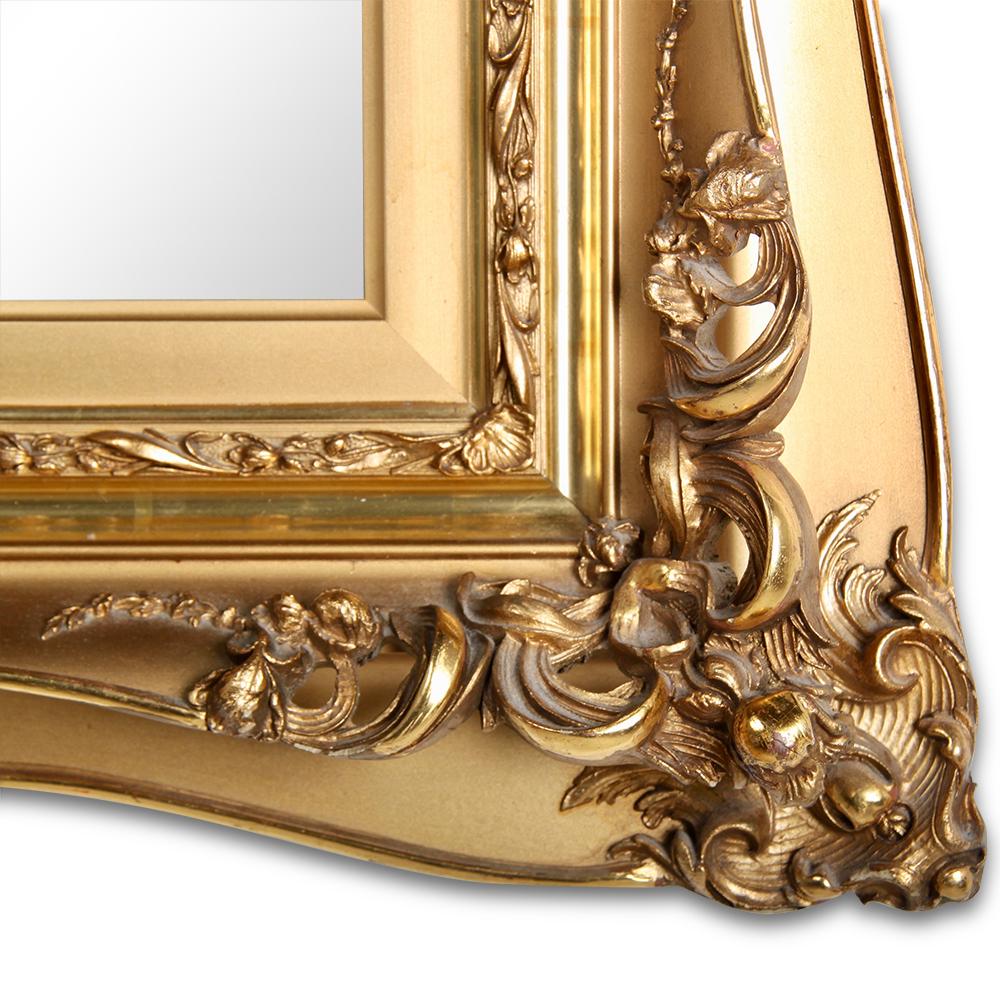 A highly-detailed Victorian gilt mirror, the complex shaped and carved double-edged frame with a striking contrast of bright burnished gilding and matt gold. The mirror may be hung either horizontally or vertically.


