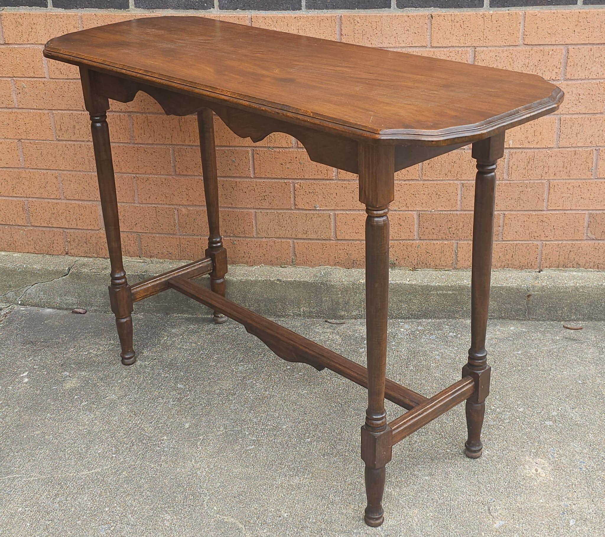 An Early 20th Century Victorian Mahogany Trestle Console Table. Measures 42.5