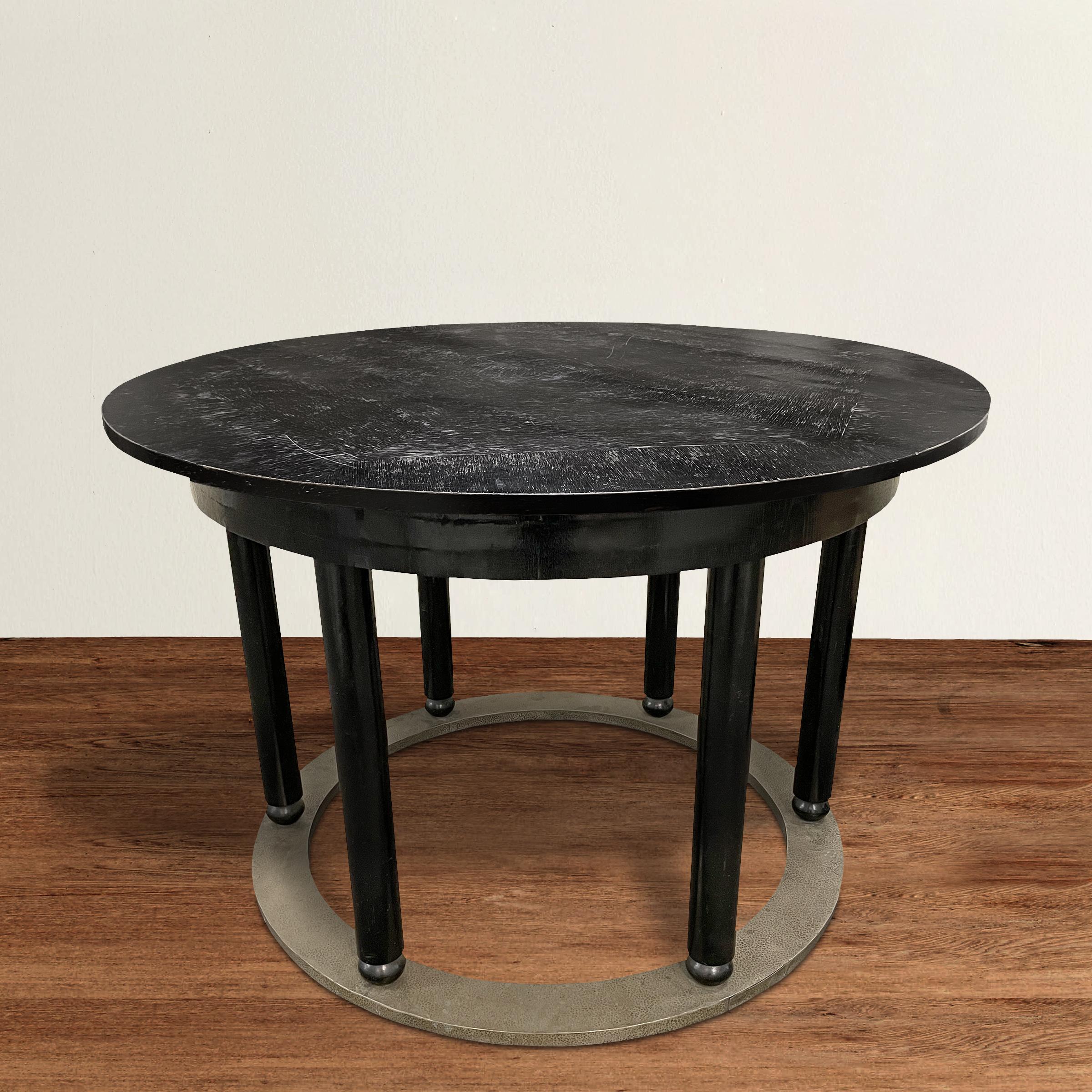 An incredible early 20th century Vienna Secession center table with six legs ending in ball feet, and resting on a hand-hammered white brass ring base. It's possible this piece was designed by famed Modernist theorist Adolf Loos, but we're not 100