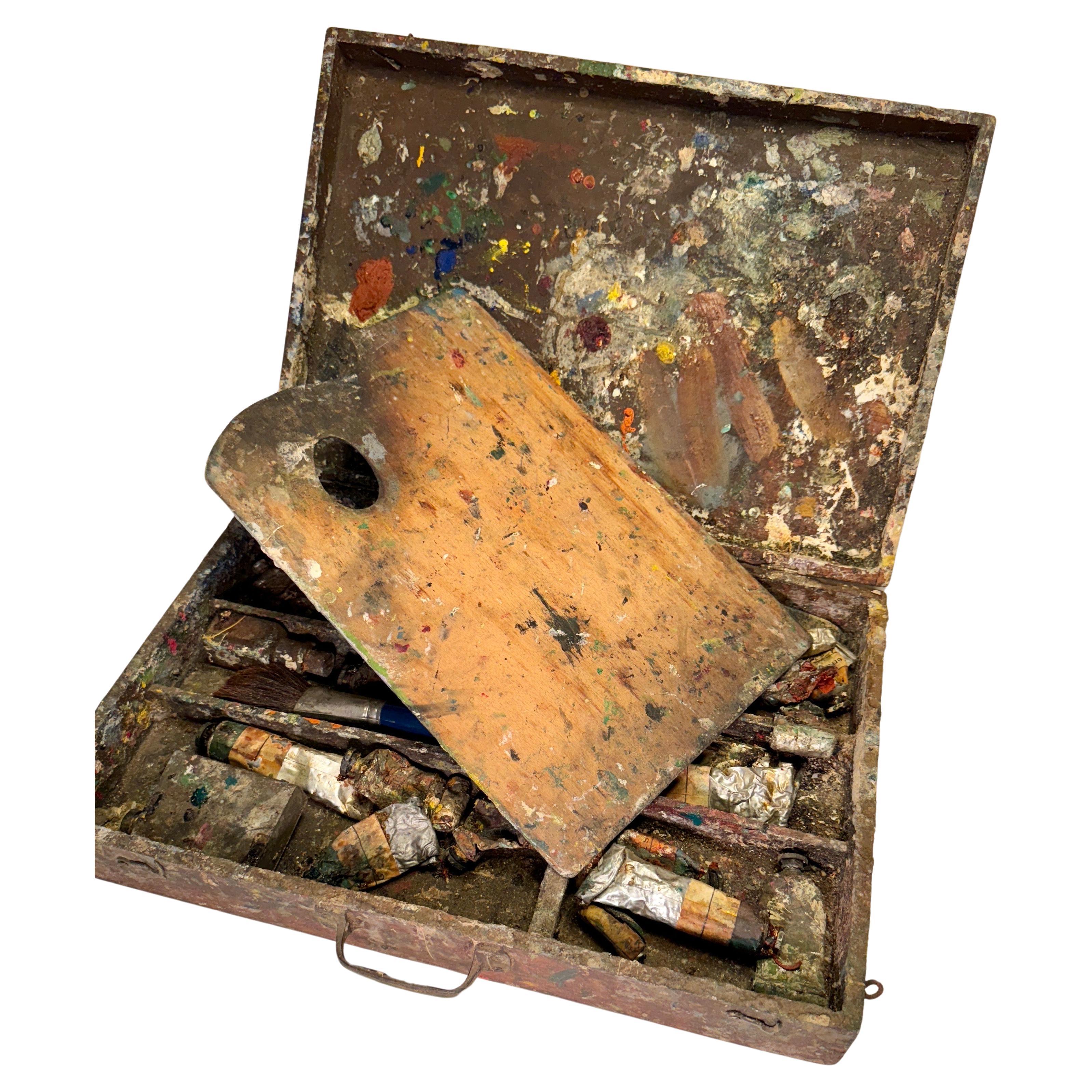 Danish Vintage Artists Paint Box and Pallet, Early 20th Century 

Well loved Danish artists traveling wooden box with everything needed to paint on location. This charming box, acquired directly from an artists studio in Jutland, features several