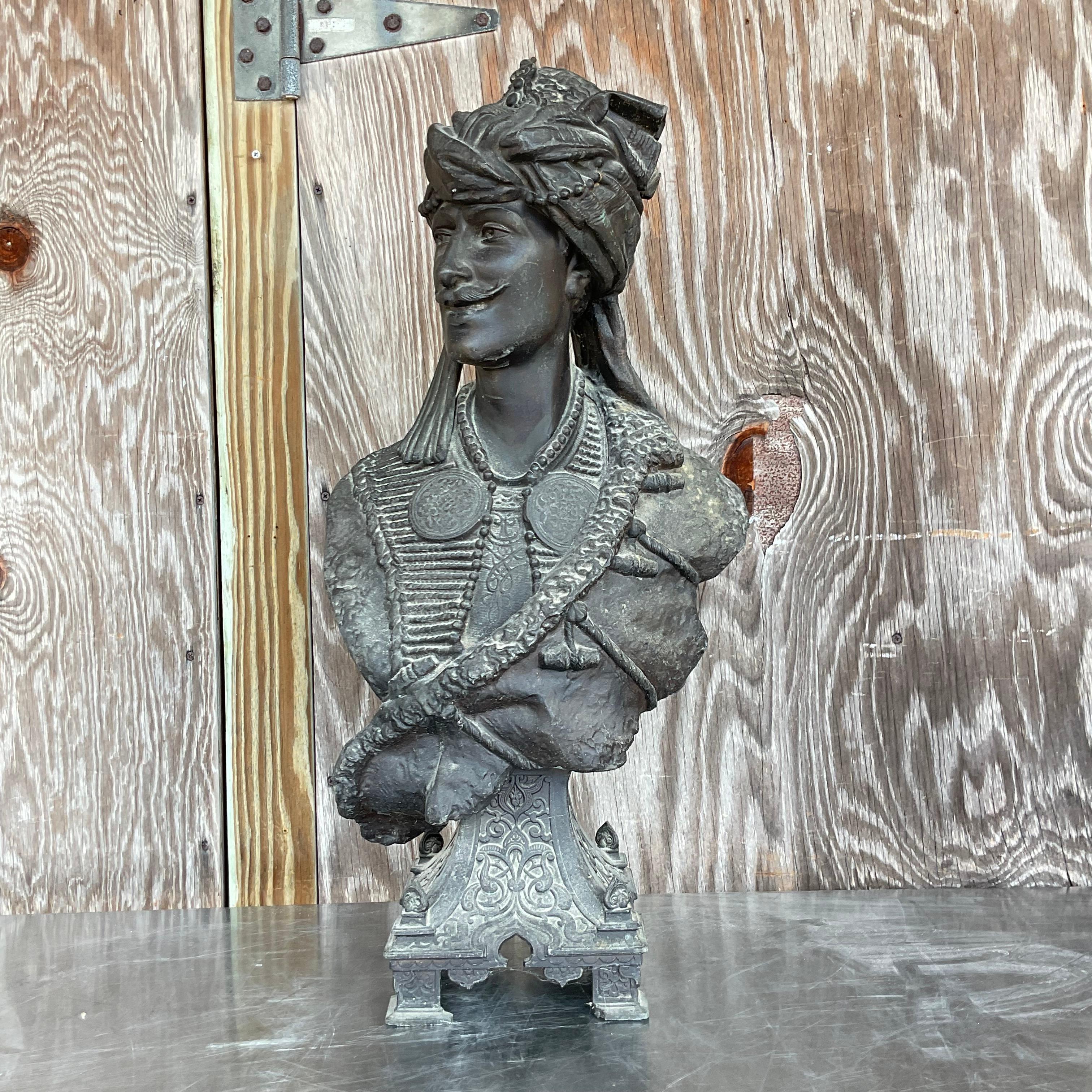 Embrace the eclectic charm of Boho style with this vintage patinated metal bust of a Moorish man. Crafted with intricate detail and rich character, this piece exudes a timeless allure that resonates with American collectors of unique treasures.