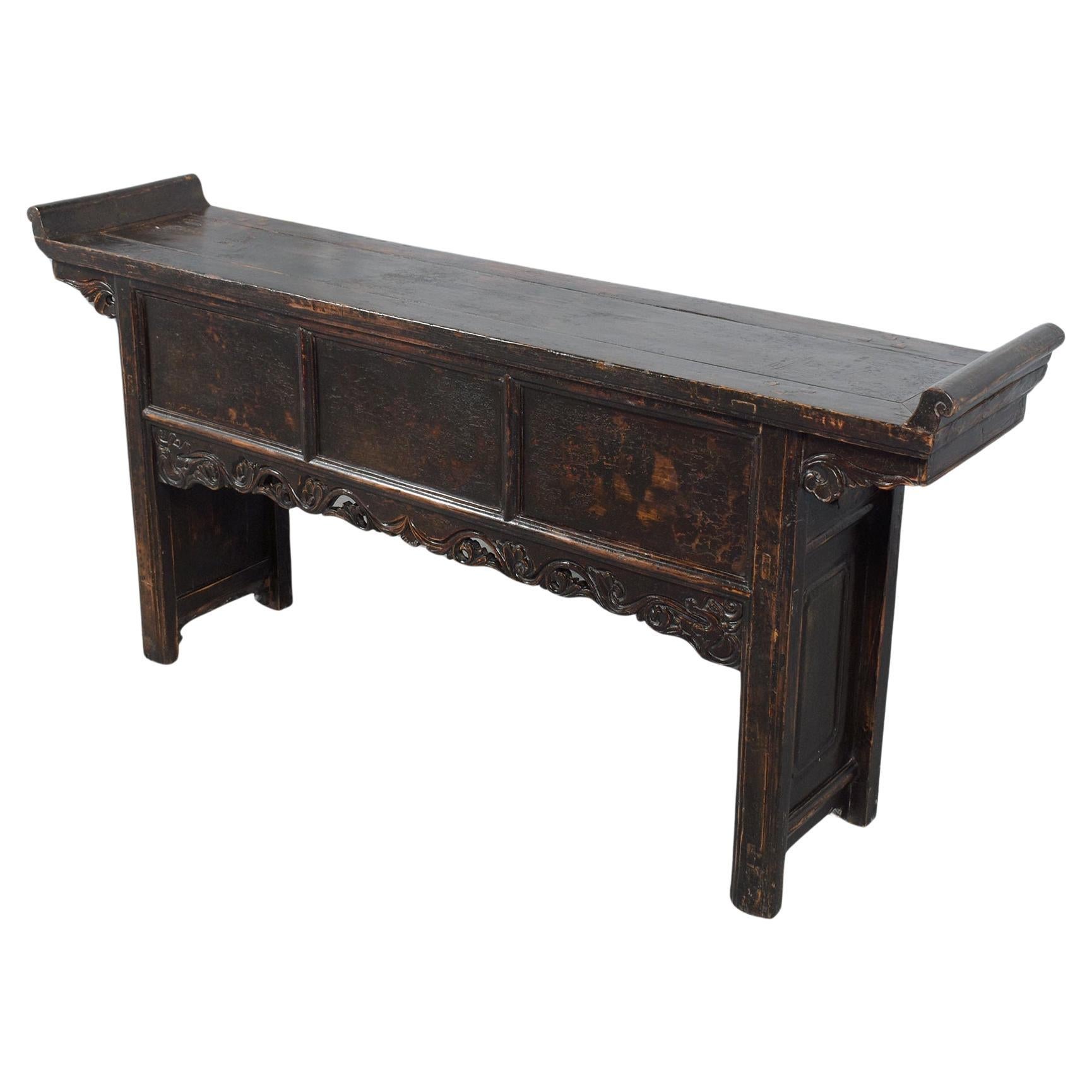 Discover the timeless elegance and exceptional artisanship of our early 20th-century Chinese altar console, meticulously revived by our dedicated craftsmen. Originating from a rich historical lineage, this distinguished piece features robust solid