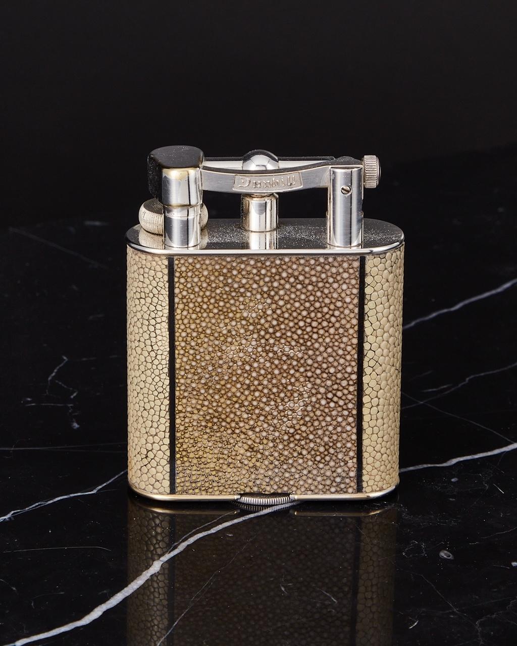 An early 20th century vintage dunhill shagreen table lighter circa 1930. 

A great looking piece which is in excellent condition. The segmented muted colours enhance the shagreen and work extremely well with the look of the lighter. A great