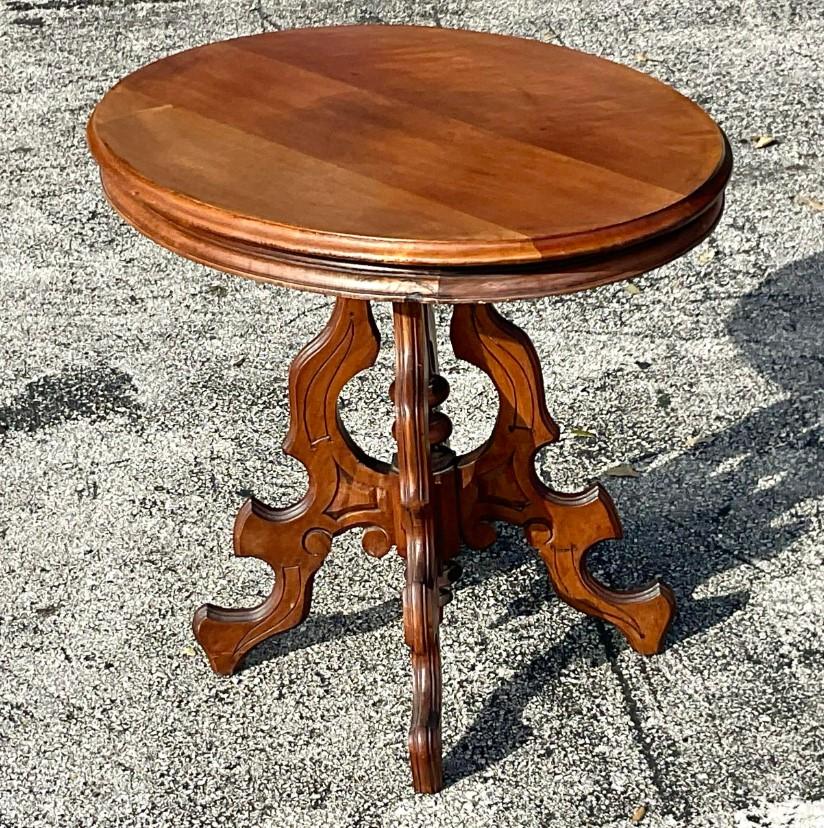 A fabulous vintage Boho side table. A classic East Lake design with a wooden oval top. Acquired from a Palm Beach estate.