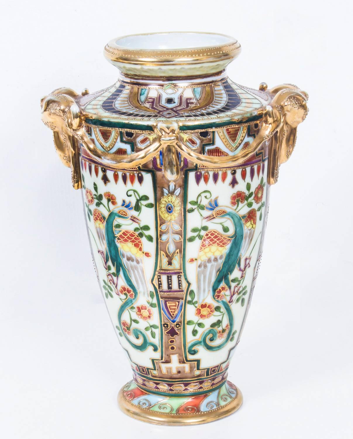 This is a beautiful pair of vintage hand-painted Noritake porcelain vases, circa 1920.

They feature attractive multicolored decoration with floral patterns, foliage, birds and wonderful gilded highlights. 

In still a certain elegance to a