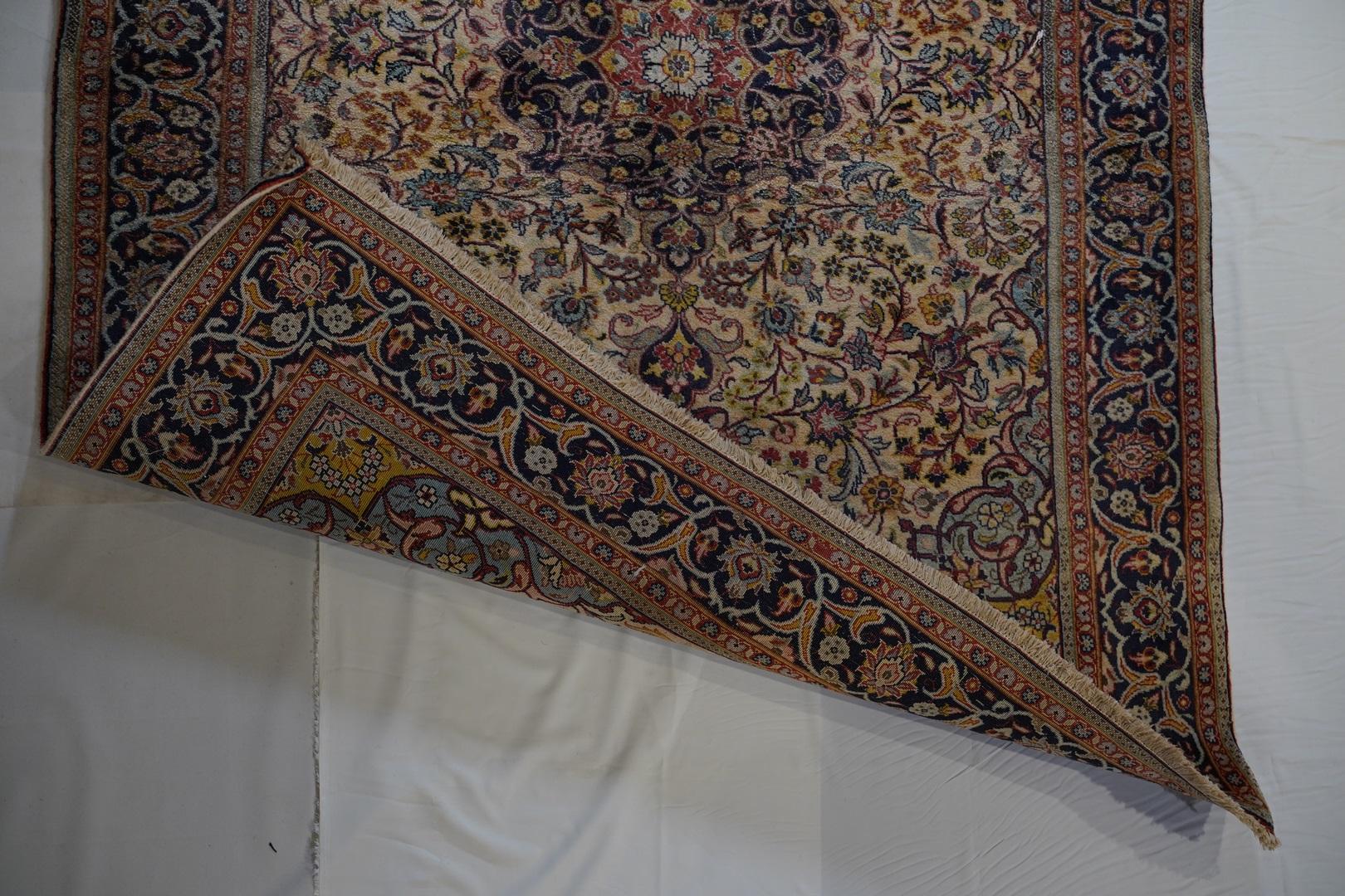 This 1940 Isfahan  balances beautifully executed soft tone colors with intricate design. Have a look at the “rolling“ corner pieces in light blue backed by deep yellows and pinks. This is an unusual piece in terms of soft pastels and a high degree