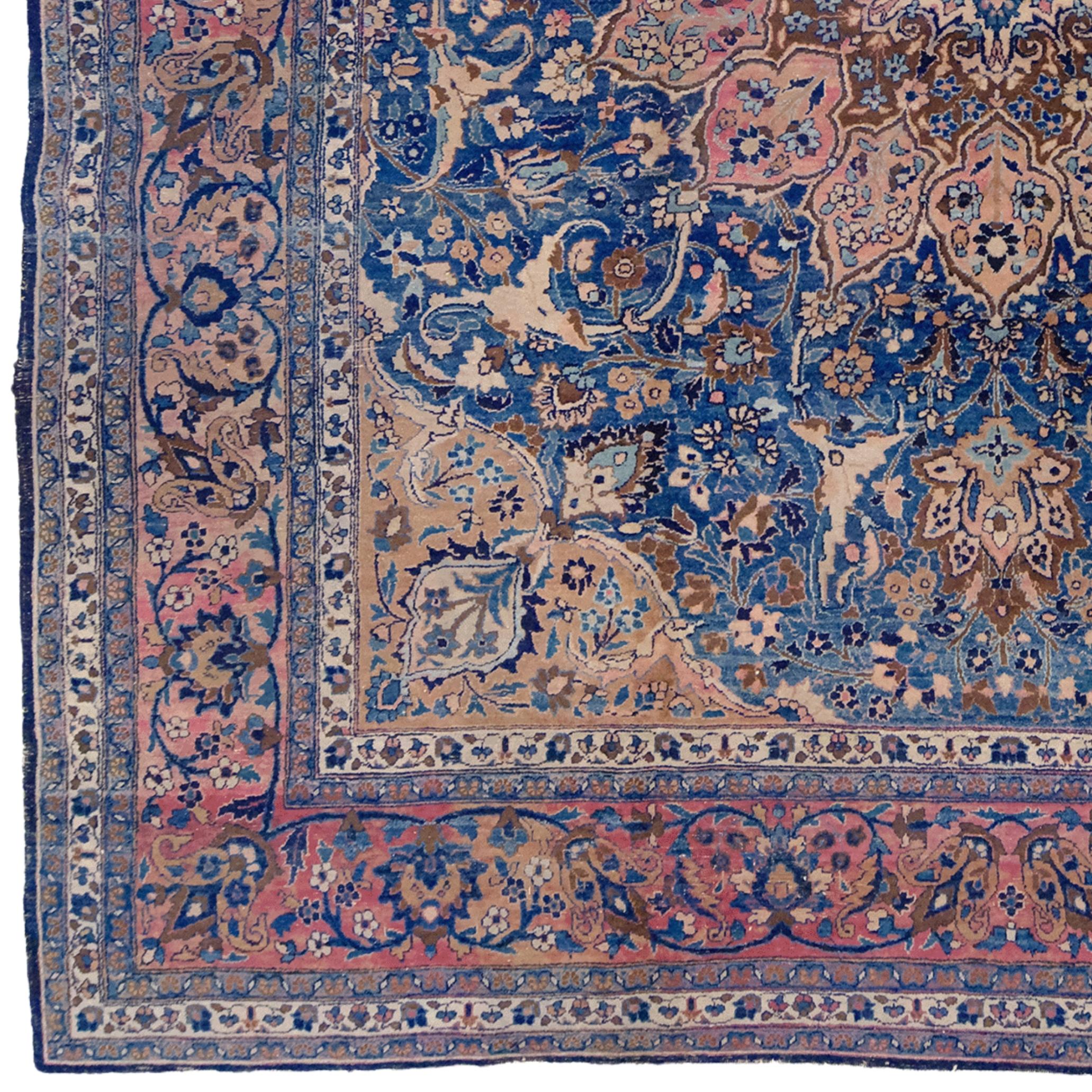 This magnificent Tabriz carpet is a rare work crafted by master carpet weavers of the Middle East in the early 20th century. Its striking blue and red hues, along with delicate floral and leaf motifs, create a dazzling composition at its